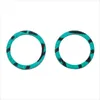 Two circular gaskets with a teal and black striped pattern, isolated on a white background. Produktbild-Vorschau