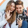 A couple is taking a selfie while camping. Produktbild-Vorschau