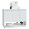 A white sideboard with decorative items on top and books on the shelf below. Anteprima dell’immagine prodotto