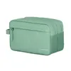 A green toiletry bag with the brand name 'travelite' printed on it, isolated on a white background. Náhled obrázku produktu