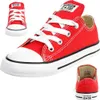 Multiple views of a pair of red Converse Chuck Taylor All Star sneakers against a white background. Voir les images du produit
