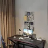 A gaming desk setup with a computer, keyboard, mouse, lamp, and a wall-mounted shelf. Produktbild-Vorschau