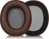 Two brown headphone ear pads with gray mesh inserts are shown on a white background. Podgląd zdjęcia produktu