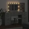 A vanity table with a mirror and lights, a stool, and some decorative items. Náhled obrázku produktu