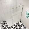 A modern bathroom with a walk-in shower. Produktbild-Vorschau