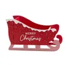 A red Christmas sleigh decoration with white snow-like trim and 'Merry Christmas' text. Produktbild-Vorschau