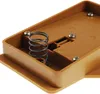 A close-up view of the inside of a brown plastic casing, showing a metal spring and screws. Produktbild-Vorschau