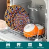 A dishwasher rack holding colorful plates and bowls. Náhled obrázku produktu