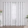 A pair of white curtains with a silver marble pattern hanging in front of a window. Produktbild-Vorschau