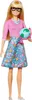 A Barbie doll standing against a white background, holding a globe. Podgląd zdjęcia produktu