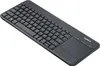 A black wireless keyboard with a built-in trackpad, shown from a slightly elevated diagonal angle on a white background. Anteprima dell’immagine prodotto