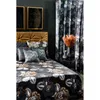 A bedroom scene with a bed, curtains, and artwork. Produktbild-Vorschau