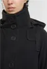 Close-up of a black jacket with buttons and a hood. Produktbild-Vorschau