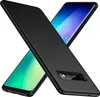 Two smartphones, one with a black case, are shown diagonally against a white background. Voir les images du produit