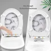 A split image showing a toilet seat with a marble pattern. The left side shows a hand pressing a button to release the seat, while the right side shows the seat detached. Produktbild-Vorschau