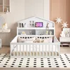 A white children's house-shaped bed with a built-in bookshelf and railing, set in a bedroom with decorative elements. Náhled obrázku produktu