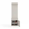 A tall, narrow beige entryway organizer with a shelf, coat hooks, a drawer, and a shoe cabinet with a door ajar. Produktbild-Vorschau