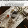 A marble table with tea cups, a teapot, and an open electric kettle, with a bouquet of flowers in the background. Produktbild-Vorschau