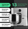 A silver stand mixer is shown in front of a split background of black and green with text overlays highlighting its features. Náhled obrázku produktu