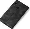 A black flip cover case for a smartphone, shown from a diagonal angle on a white background. Produktbild-Vorschau