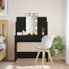 A bedroom scene with a black vanity table with a lighted mirror, a chair, and a bed. Produktbild-Vorschau