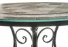 Close-up of a round table with a mosaic-patterned top and a glass overlay. Náhled obrázku produktu