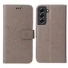 A flip cover phone case with a floral and butterfly design is shown, with the front and back views displayed side-by-side. Produktbild-Vorschau