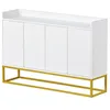 A white sideboard with four doors and a gold metal frame is shown against a white background. Anteprima dell’immagine prodotto