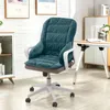 A teal office chair cushion with a quilted pattern is shown in a well-lit room with a desk and cabinets in the background. Náhled obrázku produktu
