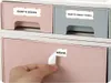 A hand is shown peeling a label from a drawer organizer. Podgląd zdjęcia produktu