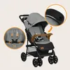 A gray and black Lionelo Emma Buggy stroller is shown against a light gray background. Insets highlight the safety harness and the stroller's handle. Podgląd zdjęcia produktu