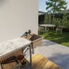 An outdoor sink area with a table and chairs in the background. Anteprima dell’immagine prodotto