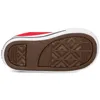 The sole of a red Converse Chuck Taylor All Star sneaker. Voir les images du produit