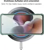 A smartphone in a green case is placed on a wireless charger. Produktbild-Vorschau