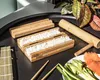 A sushi-making set with rice, bamboo mats, and ingredients like salmon and avocado. Náhľad obrázku produktu