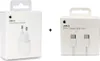 Two white boxes of Apple charging accessories are shown side-by-side with a plus sign in between them. Produktbild-Vorschau