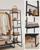 A multi-panel image showcasing a black metal garment rack with clothing, accessories, and shoes. Náhled obrázku produktu