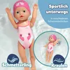 A BABY born doll in a pink swimsuit and swim cap is shown floating in water, with a smaller inset image of the doll also in water. Text overlays describe swimming techniques. Produktbild-Vorschau