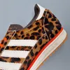 A close-up view of an Adidas shoe with a leopard print pattern. Podgląd zdjęcia produktu