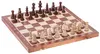 A wooden chess set with pieces arranged on the board. Produktbild-Vorschau