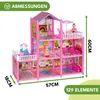 A pink dollhouse with multiple floors, furniture, and dolls, with dimensions indicated by text overlays. Náhled obrázku produktu