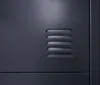 A close-up view of a dark gray metal locker with ventilation slots. Produktbild-Vorschau