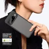 A woman is holding a smartphone with a protective case. Produktbild-Vorschau