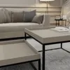 A living room scene with a sofa and coffee tables. Produktbild-Vorschau