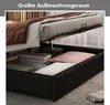 A bed with its storage compartment open, showing stored items. Produktbild-Vorschau