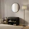 A shoe cabinet with a seat is placed in a room with a mirror and a floor lamp. Náhľad obrázku produktu