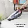 A hand is using a handheld vacuum cleaner on a couch. Produktbild-Vorschau