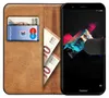 A brown leather book-style phone case with a smartphone inside, showing cards and euro banknotes. Anteprima dell’immagine prodotto