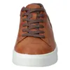 A close-up front view of a brown sneaker with white soles and brown laces. Produktbild-Vorschau