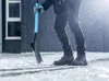 A person is shoveling snow in a snowy environment. Náhľad obrázku produktu